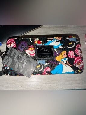 NWT Loungefly Alice in Wonderland wallet.